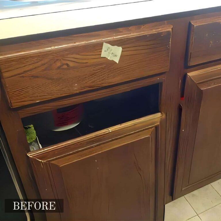 Water-damaged kitchen cabinet repair in Adelaide, showcasing bloated and stained wood repaired and refinished.