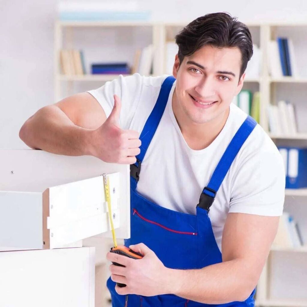 Contact us for expert cabinet repair – satisfied professional with freshly restored kitchen cabinets.