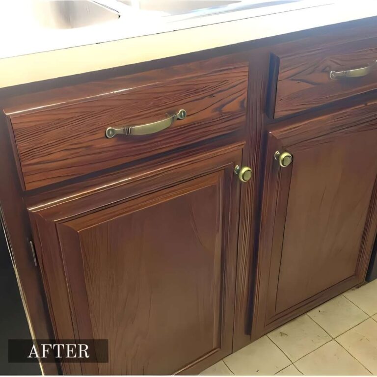 Water-damaged kitchen cabinet repair in Adelaide, showcasing bloated and stained wood repaired and refinished.